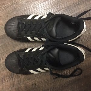 adidas Superstar shoes in black and white